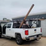 B & W truck repairing storage locker garage door