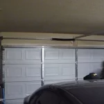 woman standing next to a repaired garage door