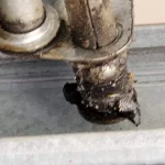 broken roller on garage door track